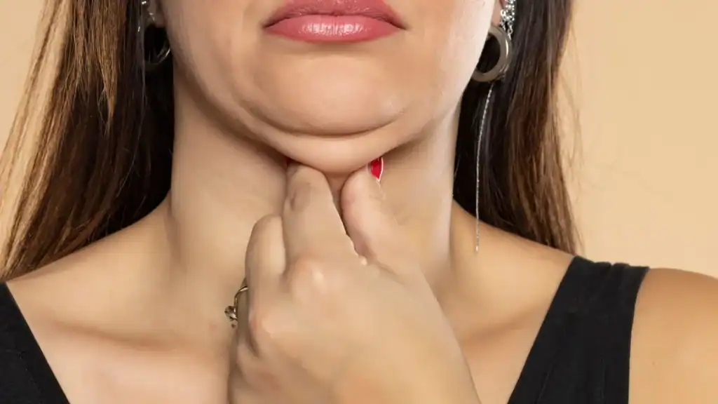 An image of a woman with double chin, sad, worried : Non Surgical Double Chin Removal Treatment in Alcester, UK